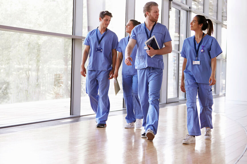 a group of nurses walking