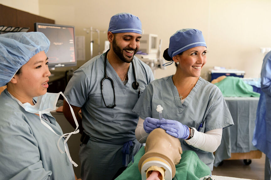 Nurse anesthesia students practicing intubation procedures in the skills lab