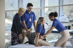 Physical Therapy students and professor demonstrating wheelchair use