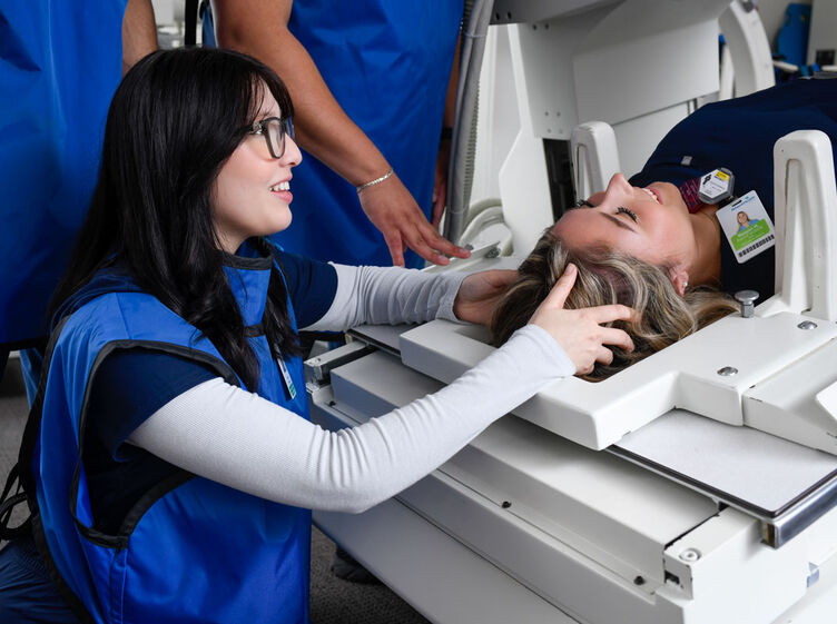 radiography students in radiography lab using equipment