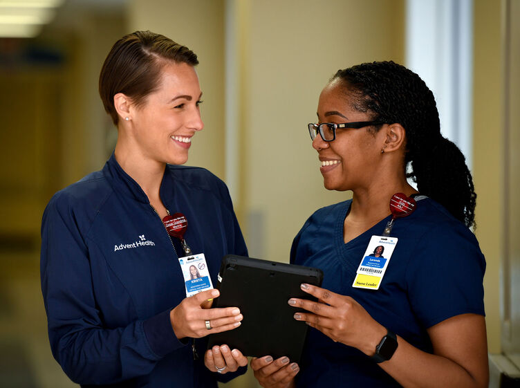 Two young female nurses working together in a hospital