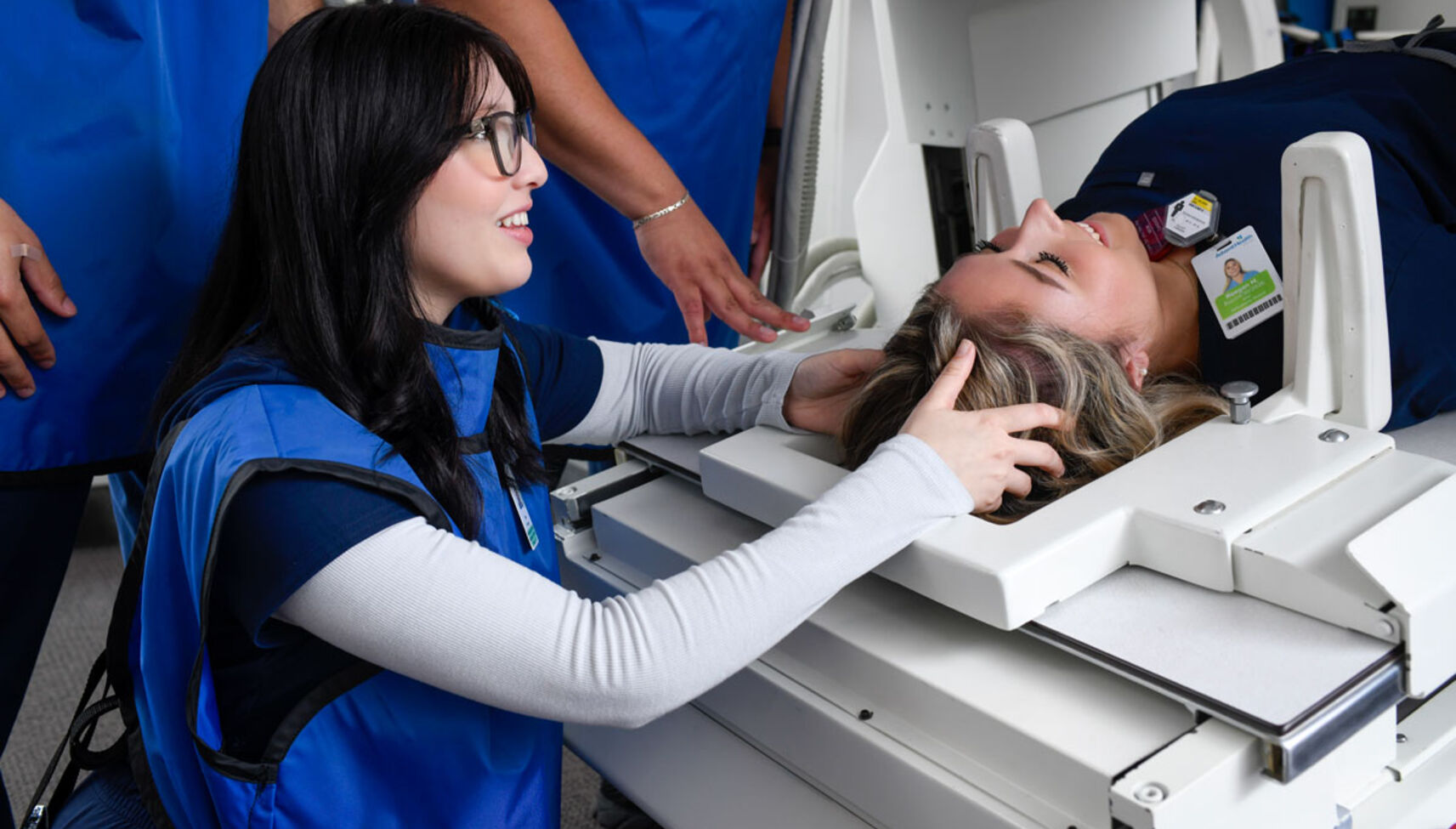 radiography students in radiography lab using equipment