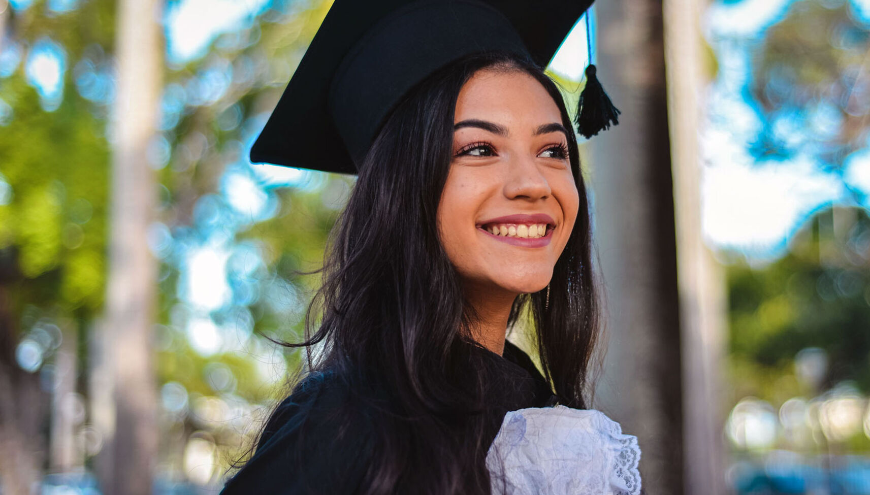A female student in graduation regalia