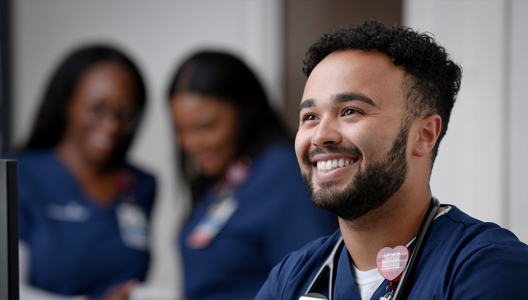 A young male nurse smiling