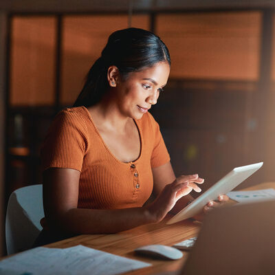 Young Woman Reading on a Tablet