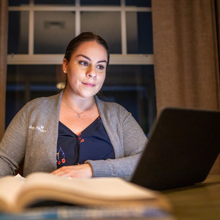 Nurse studying on a laptop