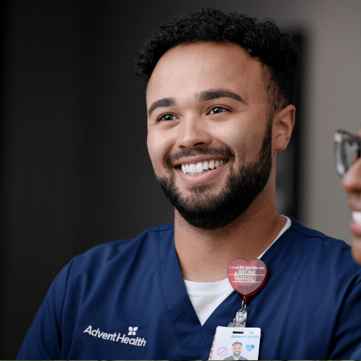 A young male nurse standing with a young female nurse